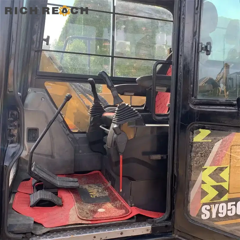 Cab interior, air suspension seat and pilot joysticks of a used Sany 95C Pro excavator