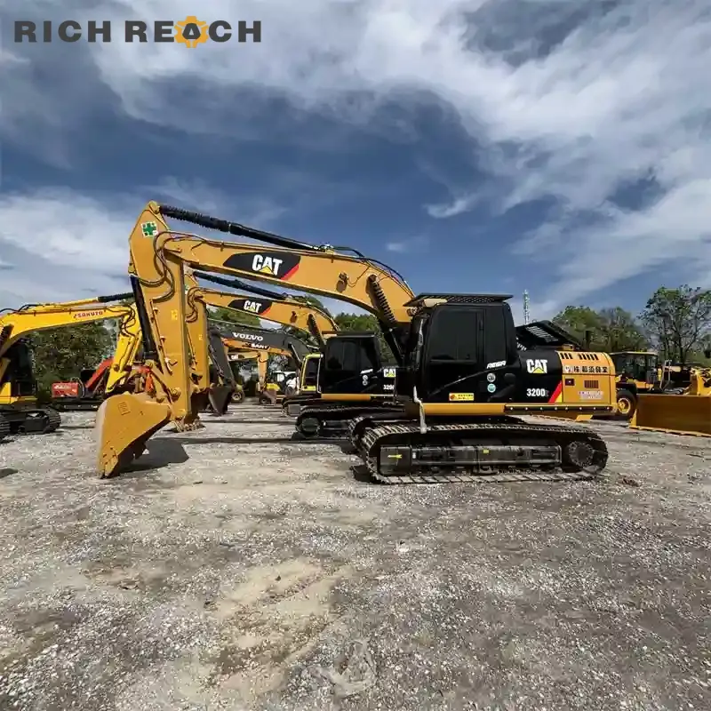 A left side three-quarter view of a yellow and black Caterpillar 320D2 crawler excavator on a gravel machinery lot under a blue sky with white clouds.