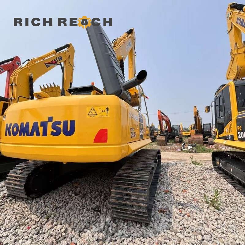 Left side view of the 2018 Komatsu PC240LC excavator with long carriage, low hours, priced at $34,722