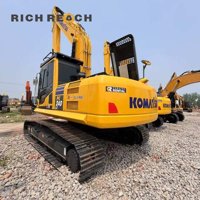 Right side view highlighting long track and final drives of a 2018 Komatsu PC240LC excavator, low hours, priced at $34,722