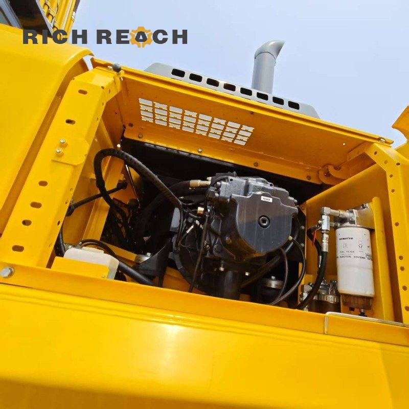 Engine bay of a 2017 Komatsu PC400‑8 excavator showing low-hour engine, 2,300 hours, $45,833