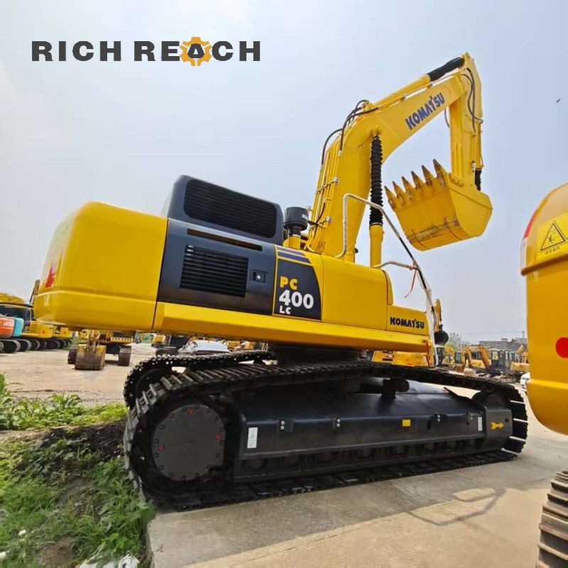 Hour meter display showing 2,300 hours on a 2017 Komatsu PC400‑8 excavator, priced at $45,833