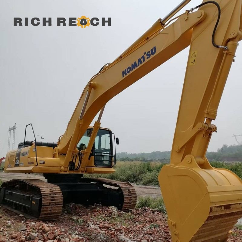 Heavy duty boom cylinder and arm with wide track shoes of a used Komatsu PC450-3 excavator, price on request in USD