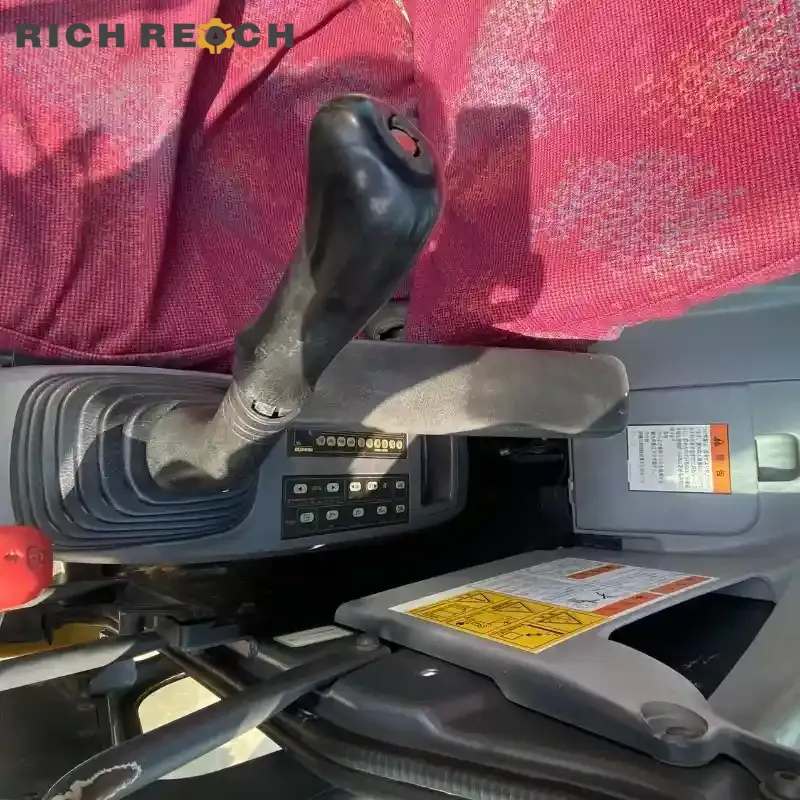 Side view of used Komatsu PC78 excavator with new undercarriage